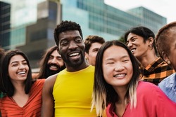 Diverse friends having fun in the city - Concept of multiracial people and friendship