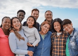Multi generational friends smiling on camera outdoor - Group of multiracial people with different ages having fun together outdoor
