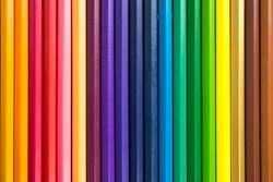 Line of colored pencils. Background of colored pencils for creativity closeup