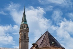 The spire of the Franciscan Church and the tiled roof of the monastery of St. Peter's Abbey, Salzburg, Austria