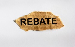 REBATE concept, on brown scrap paper and white background