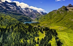 Beautiful mountain green valley landscape. Mountain green valley panorama. Village in mountain valley