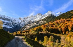 A trail in a mountain pass in autumn. Mountain pass trail. Trail in mountain pass. Autumn mountain pass trail
