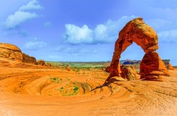 Red sand arch in canyon desert. Canyon desert sandstone arch. Sandstone arch in canyon desert. Canyon desert sandstone landscape
