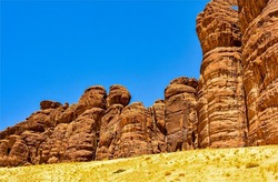 High cliffs of red sand rocks. Sandstone rocks in canyon desert. High sandstones in canyon desert. Canyon desert sandstones