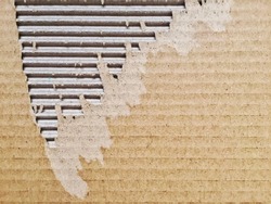 close-up view of a ripped cardboard. Packaging and cardboard box