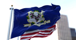 The flags of the Connecticut state and United States of America waving in the wind. Democracy and independence. American state.