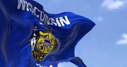 The US state flag of Wisconsin waving in the wind. Wisconsin is a state in the upper Midwestern United States. Democracy and independence.