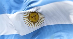 Close-up view of the national flag of the Argentine Republic. South American country. Horizontal triband of light blue (top and bottom) and white with a Sun of May centered on the white band.
