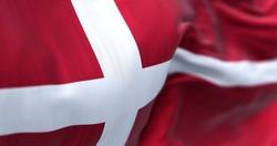Close-up view of Denmark national flag waving in the wind. Scandinavian country located in northern Europe