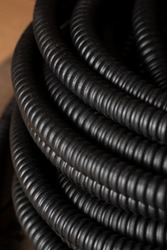 Corrugated pipe for laying electrical cable, close-up, background.