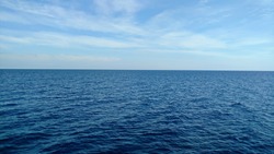 Dark blue sea and light blue sky.

