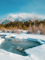 colorful view of the snow-white mountain and the river, wild life, Winter stream, winter background, travel photo