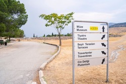Sign indicating the direction to attractions in Pamukkale, Turkey, Cotton Castle is a natural and cultural UNESCO World Heritage Site in Denizli province in southwestern Turkey.