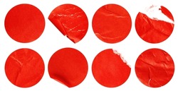 collection of eight round red stickers on a white isolated background