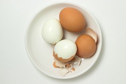 Boiled eggs on a white background. Shelled egg. Cooking chicken eggs