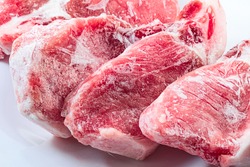 Raw frozen meat. raw pork chops