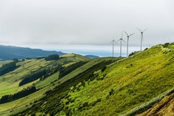 Panoramic view of wind farm or wind park, with high wind turbines for generation electricity with copy space. Green energy concept. Terceira Island, Azores, Portugal