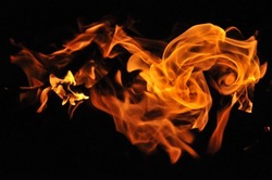 Flame on a black background. A close up shot of a fire. Fire flames on a black background abstract. Abstract fire. Fire flame texture background. Threat to life.