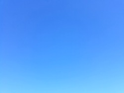 Plain light blue sky without clouds