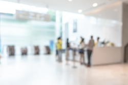 Medical blur background customer reception or patient service counter, office lobby in hospital clinic, or bank business building blurry interior inside waiting hall area 