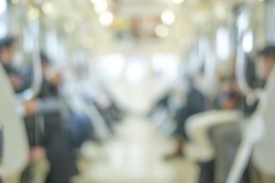 Blurred abstract background in vintage style of people commuting on Tokyo subway train
