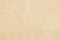 Jute hessian sackcloth canvas sack cloth woven texture pattern background  in yellow beige cream brown color
