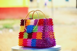 Colorful beaded bag made of square beads. Fruit basket. Travelling bag and fashion bag.