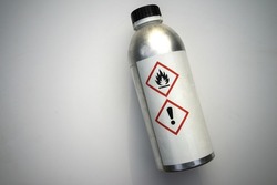 An aluminum bottle from a toxic substance on a white isolate. Toxic liquid in a bottle. Toxic production. Toxic substance.