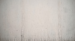 Photo of the texture of a white wooden wall with paint cracks. The background is in the style of shabby chic. Decorative panel made of white wood.
