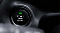 The engine start and stop button for modern car engine ignition. Keyless technology concept.