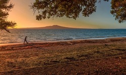 Sunrise at Takapuna Beach with Rangitoto Island in the background, Auckland, New Zealand