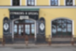 Blurred image of a shop windows with a closed sign in the early morning, work indoors. 