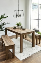 Modern kitchen and dining area. Wooden dining table