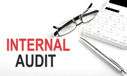 INTERNAL AUDIT Concept. Calculator,pen and glasses on white background