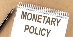 MONETARY POLICY text on notepad with pen, business