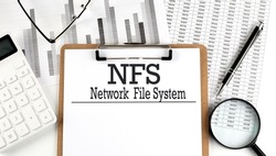Paper with NFS Network File System table on charts, business concept