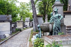 Paris graveyard bronze statue and tombs
