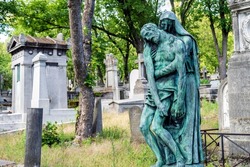 Paris graveyard bronze statue and tombs