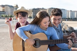 Group of teenagers with a guitar
