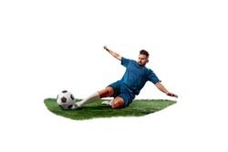 Football player tackling for the ball over white background. Professional football soccer player in motion isolated on white studio background. Fit fighting man in action, movement at game with ball.