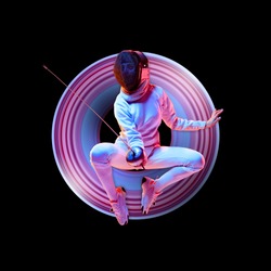 Concept of motion and action in sport. Young caucasian girl fencing in neon light on black background. Training in jump, flight. Sport, healthy lifestyle, movement, advertising. Abstract design.