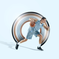 Concept of motion and action in sport. Full length portrait of a basketball player with a ball on background. Caucasian athlete in jump. Motion, activity, movement, advertising. Abstract design.