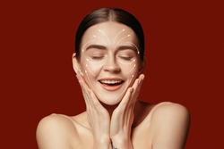 Beautiful female face with lifting up arrows isolated on red background. Concept of bodycare, cosmetics, skincare, correction surgery, beauty and perfect skin. Flyer for your ad. Antiaging.