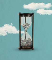 Cash, money flows into hourglass isolated on blue sky cloudy background. Contemporary art collage. Inspiration, idea, trendy urban magazine style, fashion and creativity. Copyspace for ad. Surrealism.