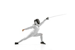 Attack. Young girl, beginner fencer in fencing costume and mask practicing with rapier isolated on white background. Sport, youth, healthy lifestyle, achievements. Copy space for ad