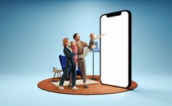Modern lifestyle. Happy family standing in front of huge 3d model of smartphone with empty white screen isolated on blue background. New app, holiday, travel, ad concept On-line shopping, sales,