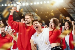 Win, goal. Group of happy thrilled excited soccer football fans cheering for their sport team victory. Concept of human emotions, global sports competitions, championship, ad. Red and white colors
