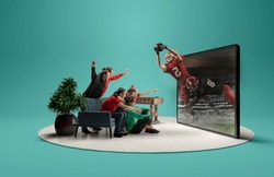 Live stream game. Group of friends sitting in front of huge 3D model of TV screen at home interior and watching online broadcast of american football match. Presence effect