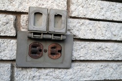 a power outlet on an exterior wall